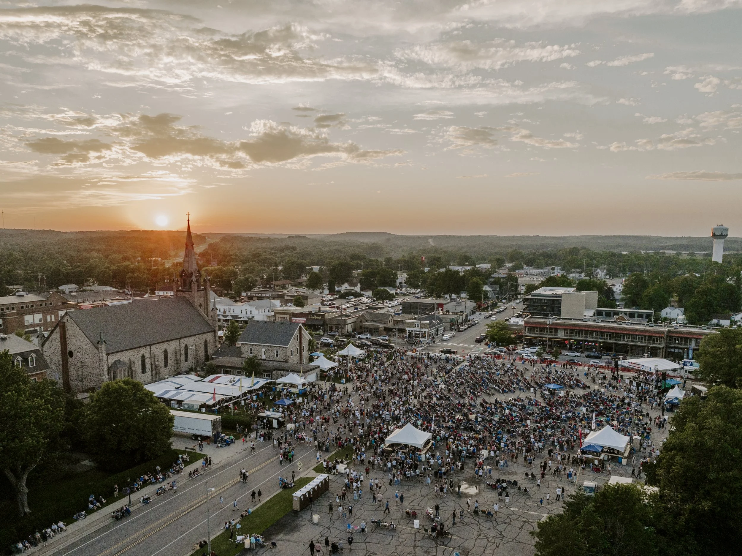 Aerial view of downtown St. Joseph and the Block Party at sunset.